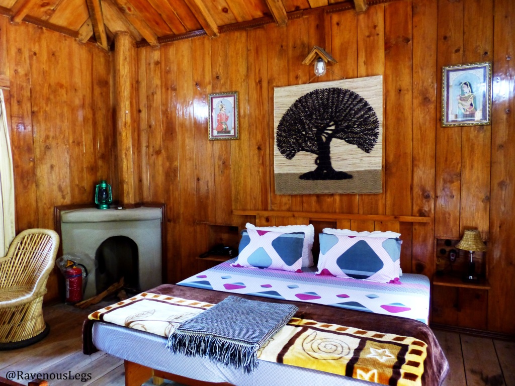 Bedroom with firewood in Barot Hut - Himachal Heritage Village, Palampur