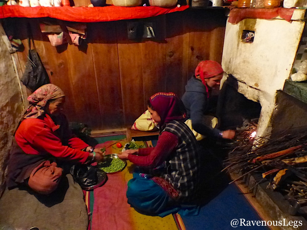 Women cooking on chulha in Traditional Himachali house in Tirthan Valley